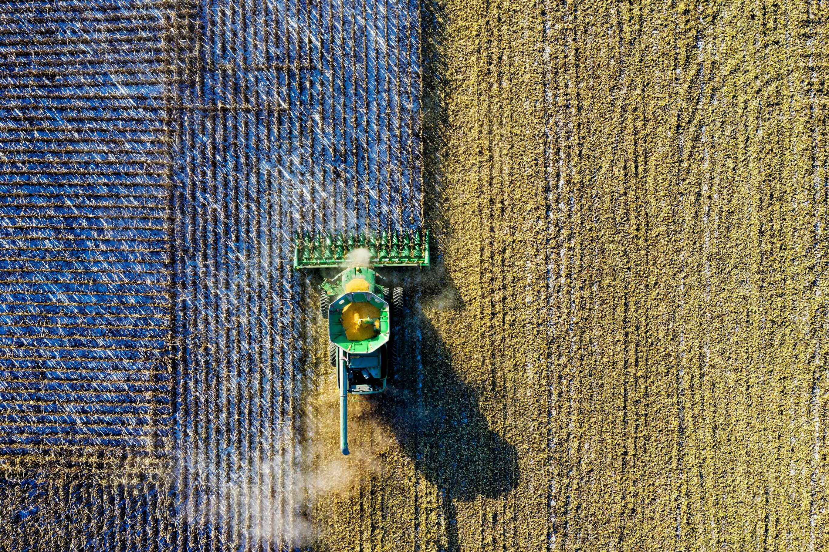 Aerial view of agricultural fields with tractor
